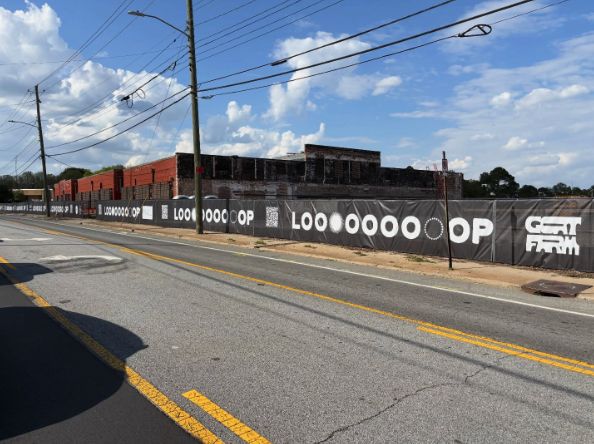 The LOOP entrance along Marietta Street, lined with LOOP and Goat Farm signage